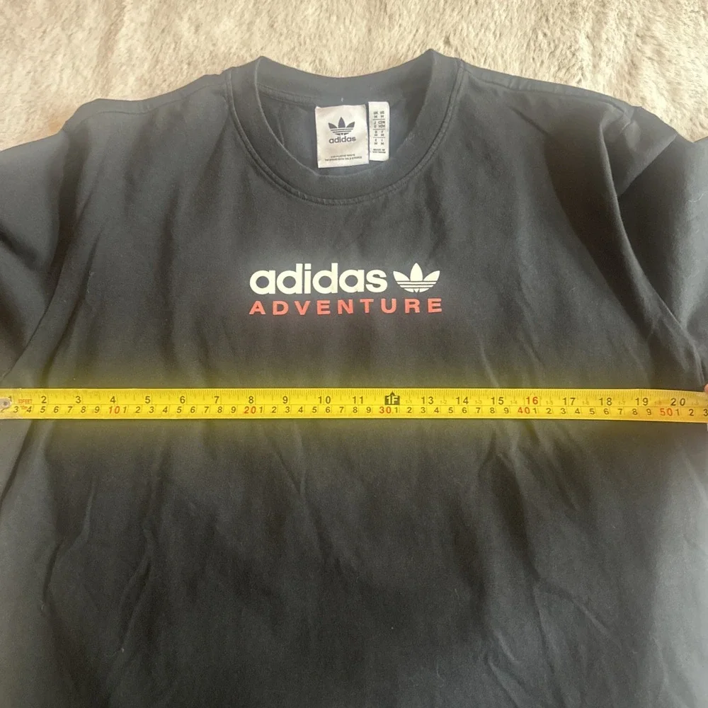 Adidas Adventure men's black graphic t-shirt‎ with Trefoil logo on chest.Size M